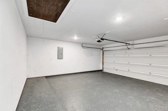 garage featuring electric panel and a garage door opener