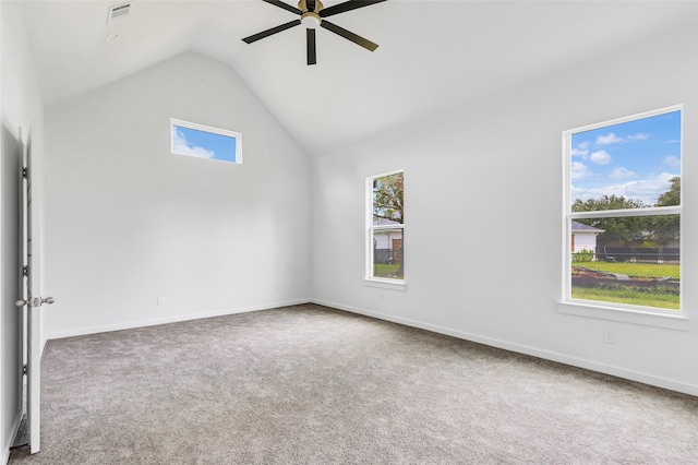 carpeted spare room with lofted ceiling and ceiling fan