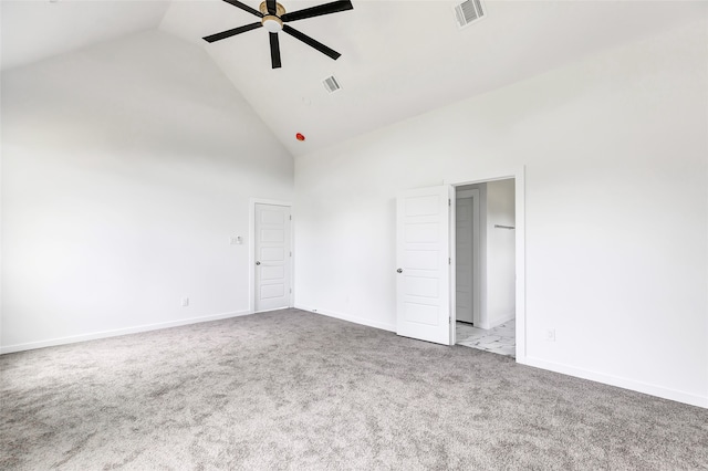 unfurnished bedroom featuring high vaulted ceiling, light colored carpet, and ceiling fan