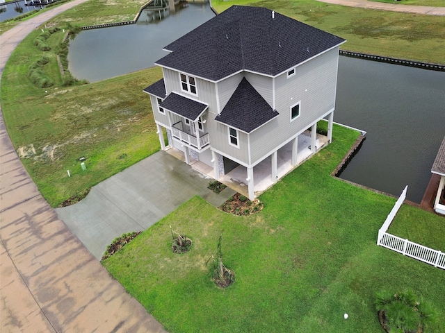 birds eye view of property with a water view