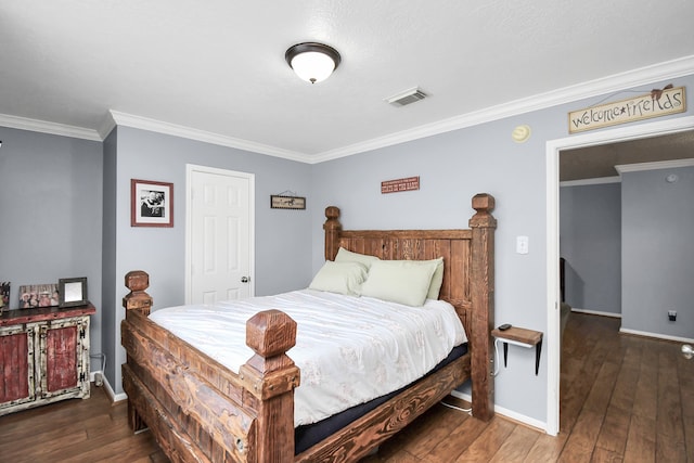 bedroom with dark wood-type flooring and ornamental molding