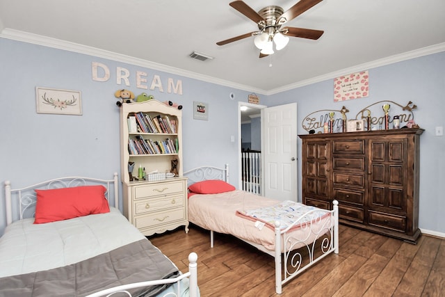 bedroom with ornamental molding, ceiling fan, and dark hardwood / wood-style floors