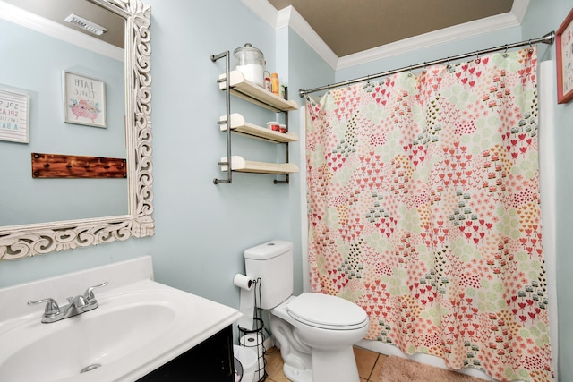 bathroom featuring ornamental molding, vanity, toilet, and tile patterned floors