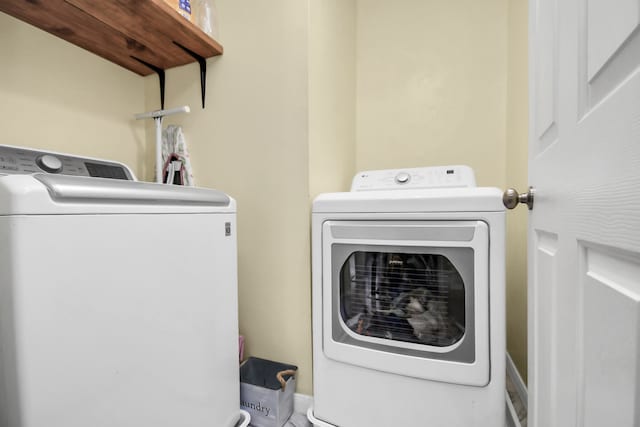 laundry area with washing machine and dryer