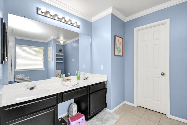 bathroom with ornamental molding, vanity, and tile patterned flooring