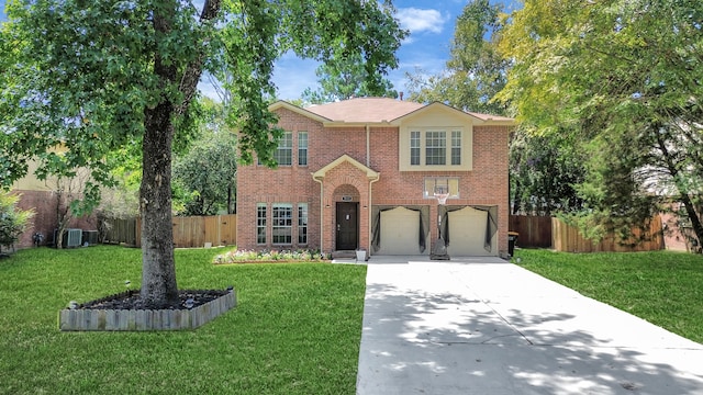 view of front facade with a garage and a front lawn