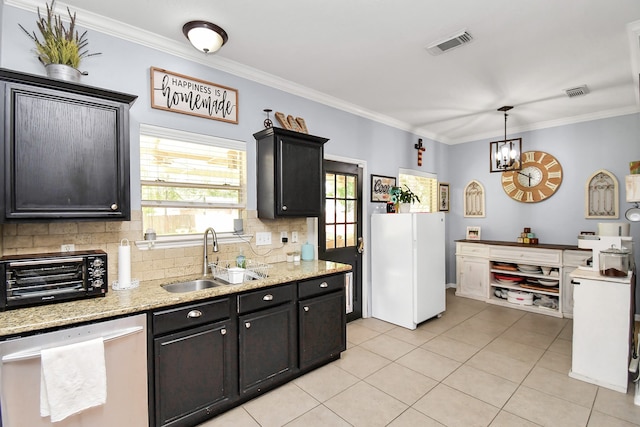 kitchen featuring ornamental molding, dishwasher, sink, and tasteful backsplash