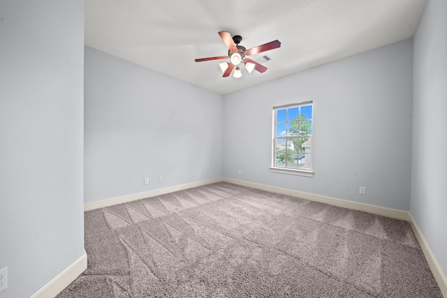 unfurnished room featuring carpet floors and ceiling fan