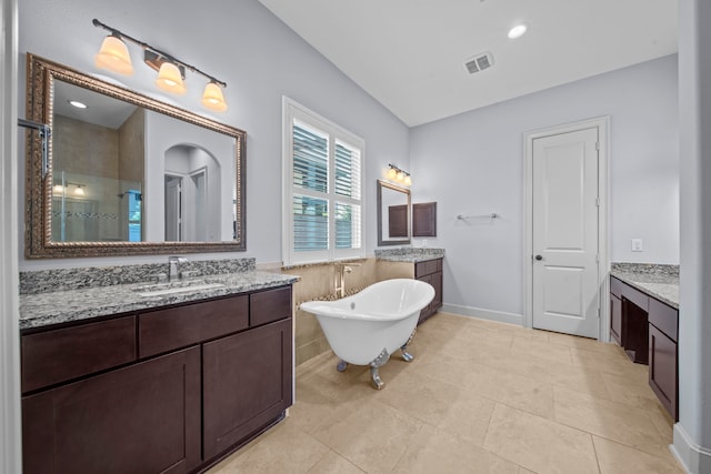 bathroom featuring tile patterned flooring, vanity, and independent shower and bath