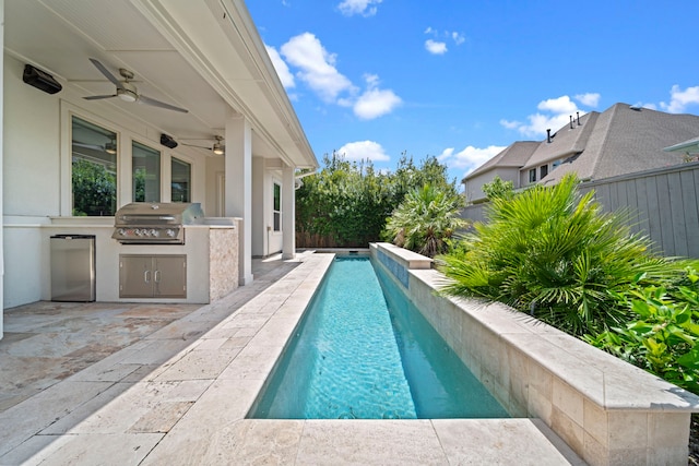 view of swimming pool featuring ceiling fan, a grill, area for grilling, and a patio area