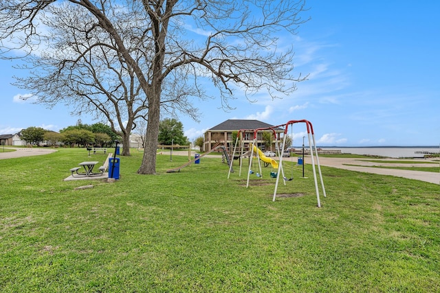 community jungle gym featuring a yard