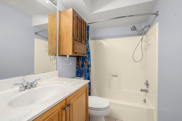 full bathroom with toilet, tub / shower combination, a textured ceiling, and vanity