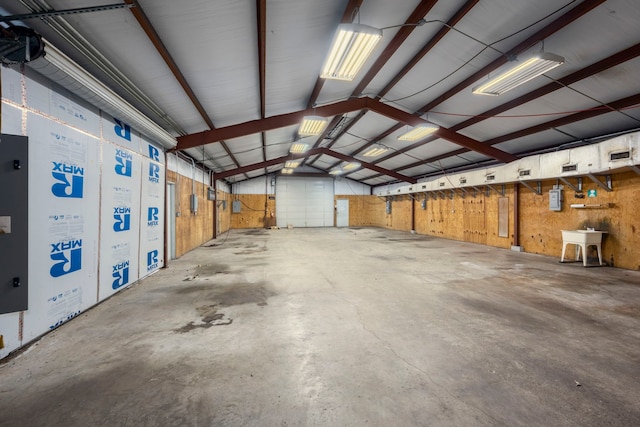 garage featuring wood walls