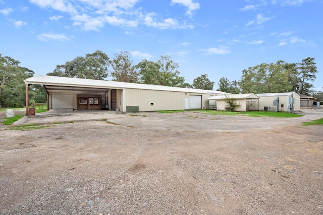 view of front of house featuring an outbuilding and a garage