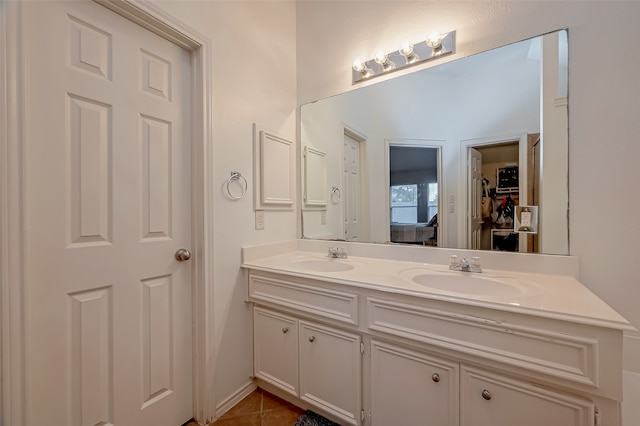 bathroom featuring tile patterned flooring and vanity