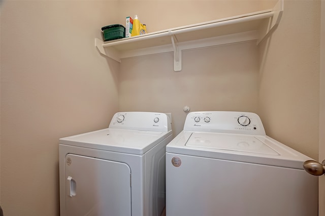 laundry room featuring washing machine and clothes dryer