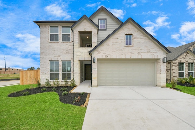 view of front facade featuring a front yard and a garage