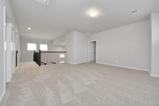 unfurnished room with light colored carpet