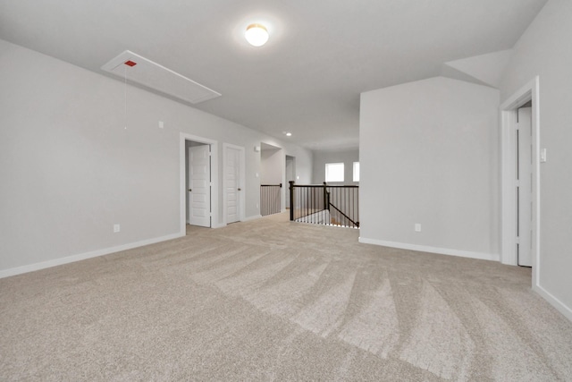 unfurnished room with light carpet