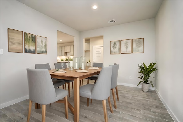 dining space featuring hardwood / wood-style floors