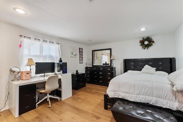 bedroom with light hardwood / wood-style flooring