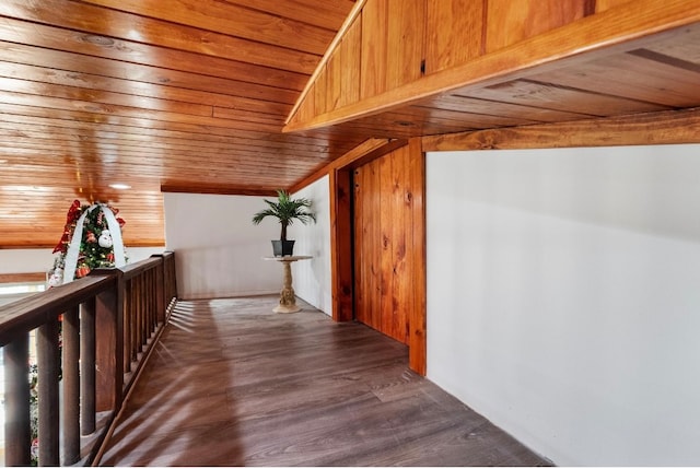 hall featuring lofted ceiling, hardwood / wood-style floors, and wood ceiling