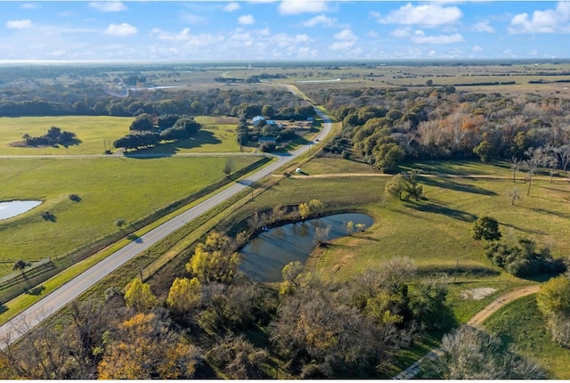 drone / aerial view with a water view and a rural view