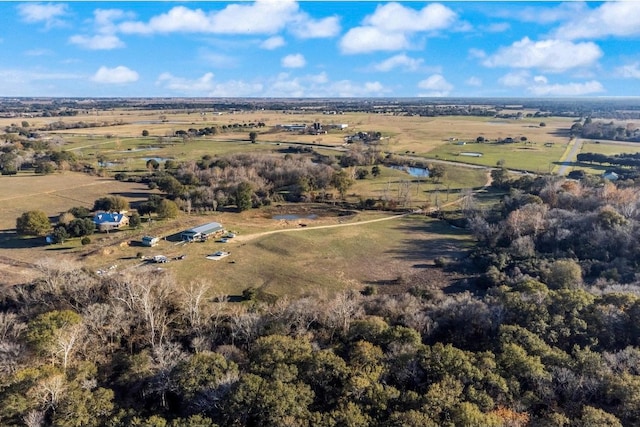 birds eye view of property with a rural view