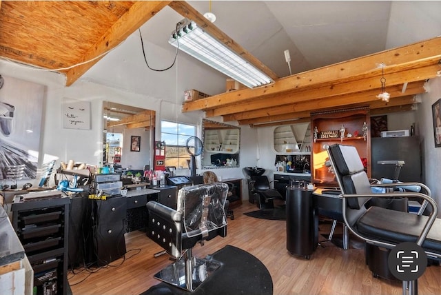 office space with lofted ceiling and hardwood / wood-style flooring