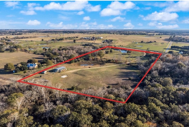 birds eye view of property with a rural view