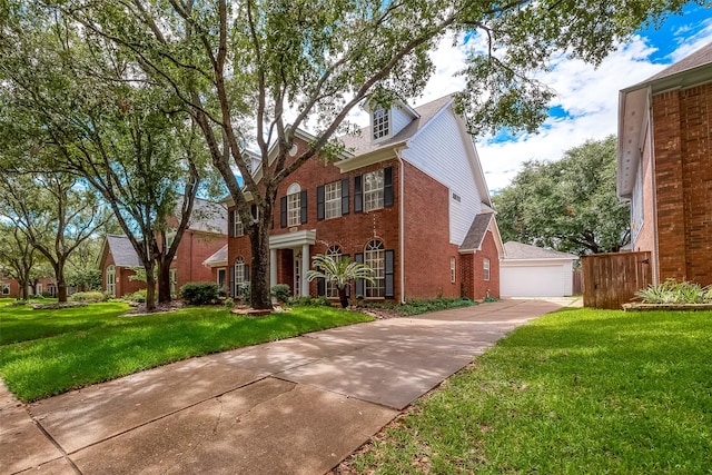 view of front of home with a garage and a front yard