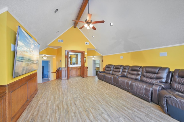 living room featuring crown molding, lofted ceiling with beams, ceiling fan, and light hardwood / wood-style floors