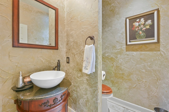 bathroom with vanity and toilet