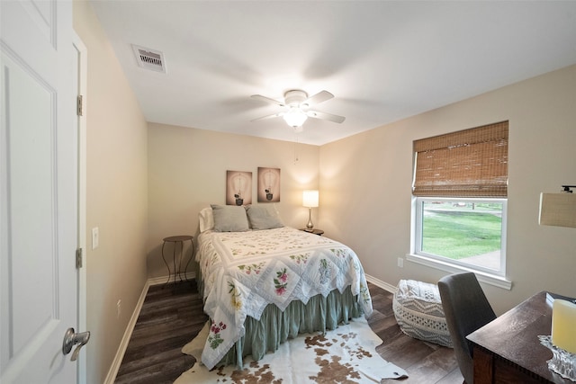 bedroom featuring ceiling fan and dark hardwood / wood-style flooring