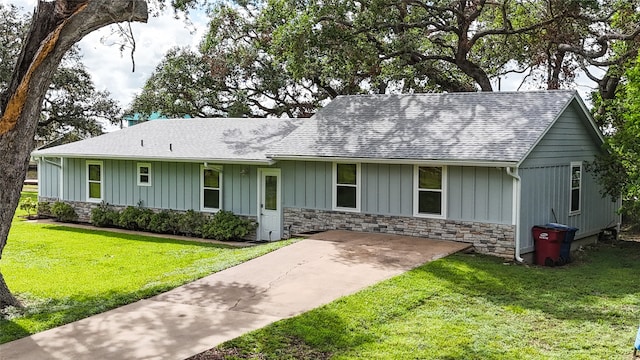 ranch-style house with a front lawn