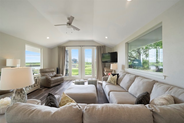 living room featuring lofted ceiling, hardwood / wood-style floors, and ceiling fan