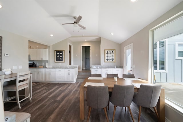 dining space featuring lofted ceiling, ceiling fan, and dark hardwood / wood-style floors