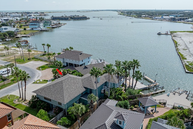 birds eye view of property with a water view