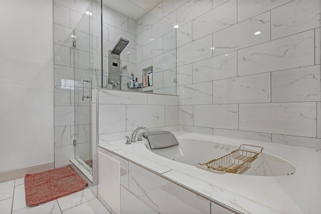 bathroom with separate shower and tub