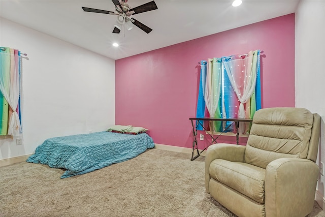 carpeted bedroom featuring ceiling fan