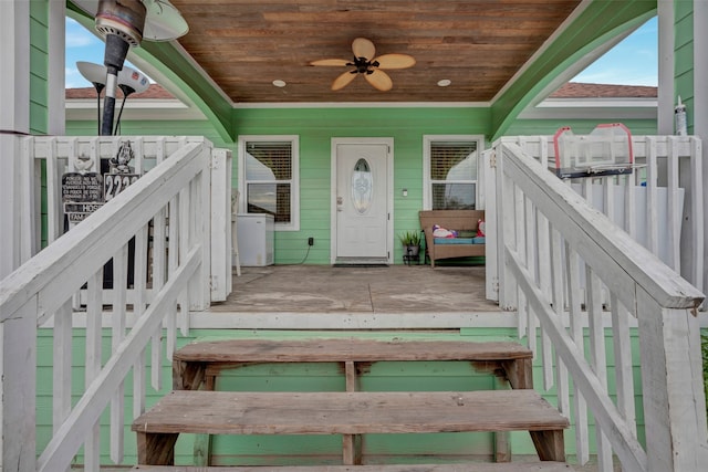 doorway to property featuring ceiling fan