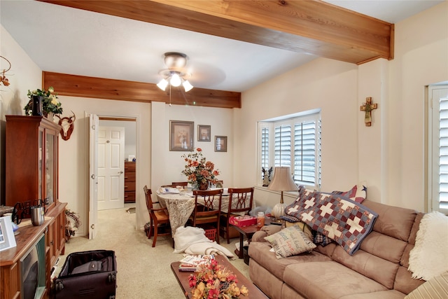 living room with light carpet, beam ceiling, and ceiling fan