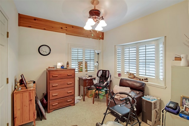 office area featuring ceiling fan and light carpet