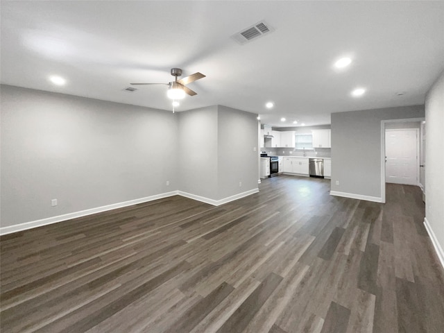 unfurnished living room with ceiling fan and dark hardwood / wood-style flooring