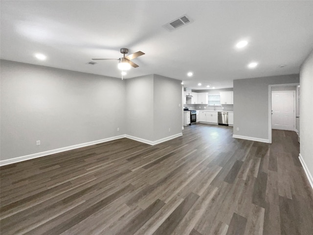 unfurnished living room featuring visible vents, ceiling fan, baseboards, recessed lighting, and dark wood-style floors