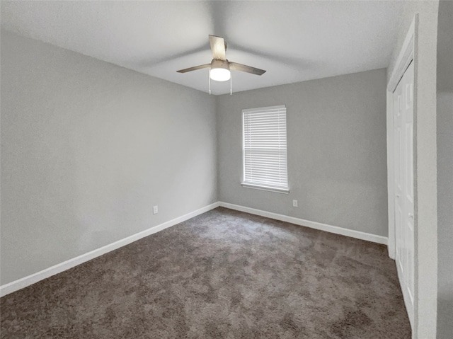 unfurnished bedroom featuring ceiling fan and carpet floors