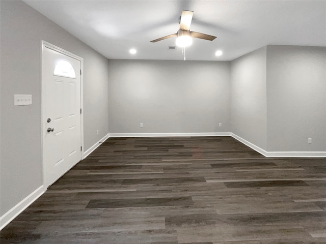 entryway featuring dark wood-type flooring and ceiling fan