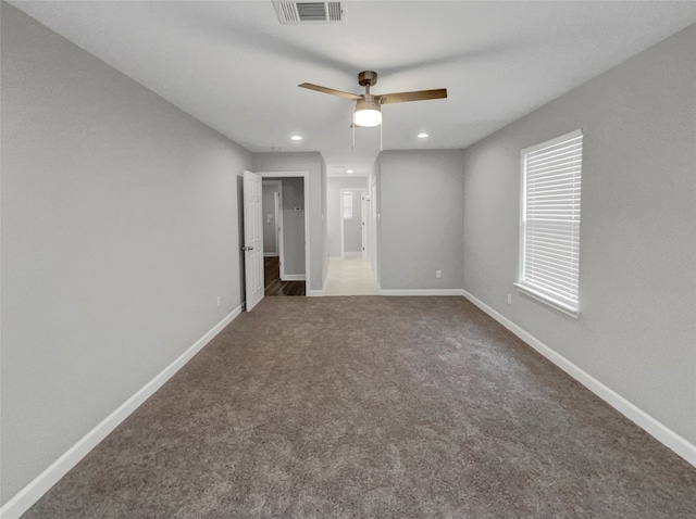 unfurnished bedroom with ceiling fan and carpet