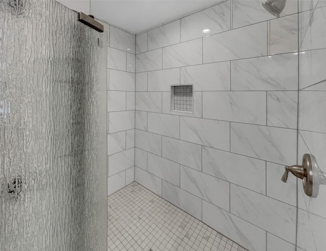 bathroom with tiled shower