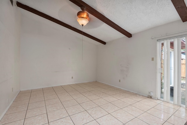 spare room featuring vaulted ceiling with beams, a textured ceiling, and light tile patterned flooring